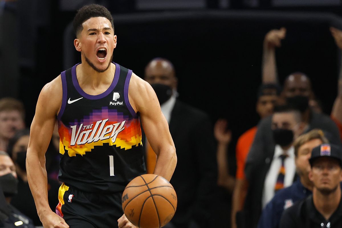 Devin Booker #1 of the Phoenix Suns reacts after scoring against the Philadelphia 76ers during the first half of the NBA game at Footprint Center on March 27, 2022 in Phoenix, Arizona. The Suns defeated the 76ers 114-104.&nbsp;
