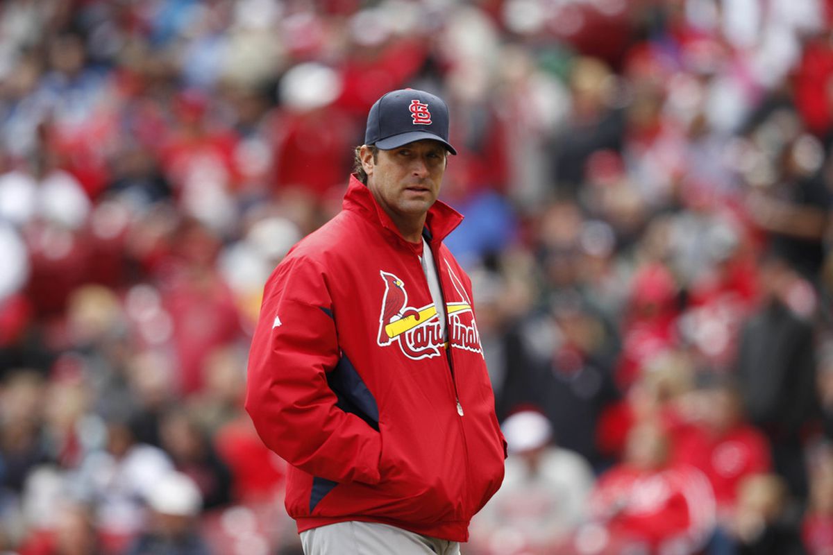 Apr 11, 2012; Cincinnati, OH, USA; St. Louis Cardinals manager Mike Matheny (22) does the scowling-in-an-oversized-windbreaker thing more handsomely than Tony La Russa. 