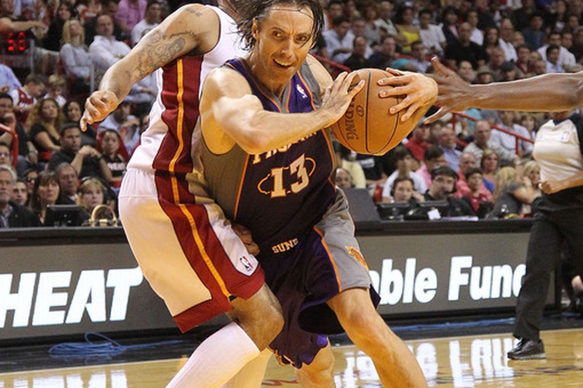 MIAMI - NOVEMBER 17:  Steve Nash #13  of the Phoenix Suns drives to the rim during a game against the  Miami Heat at American Airlines Arena on November 17 2010 in Miami Florida. (Photo by Mike Ehrmann/Getty Images)