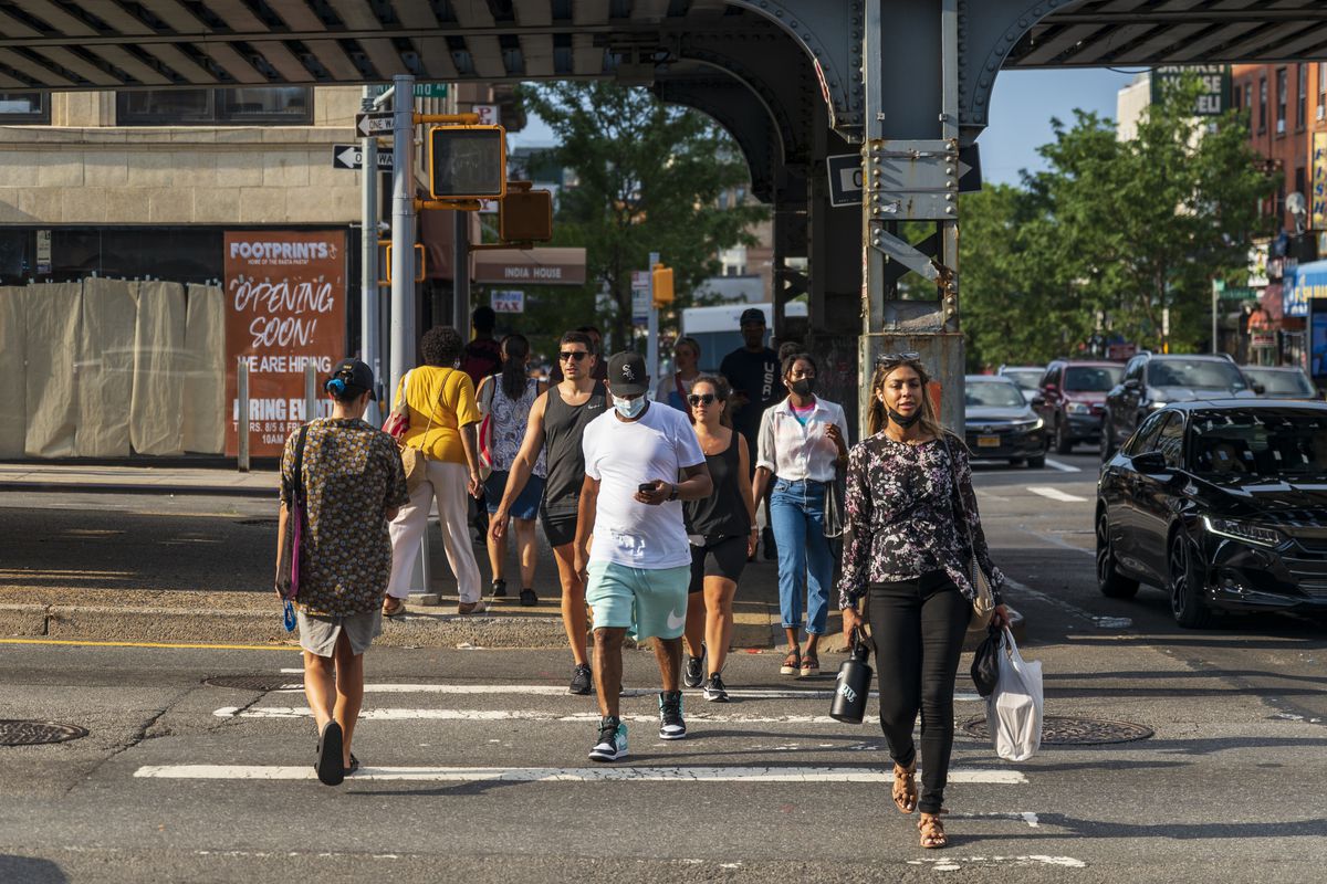 After-work commuters crossing Atlantic Avenue into Crown Heights.