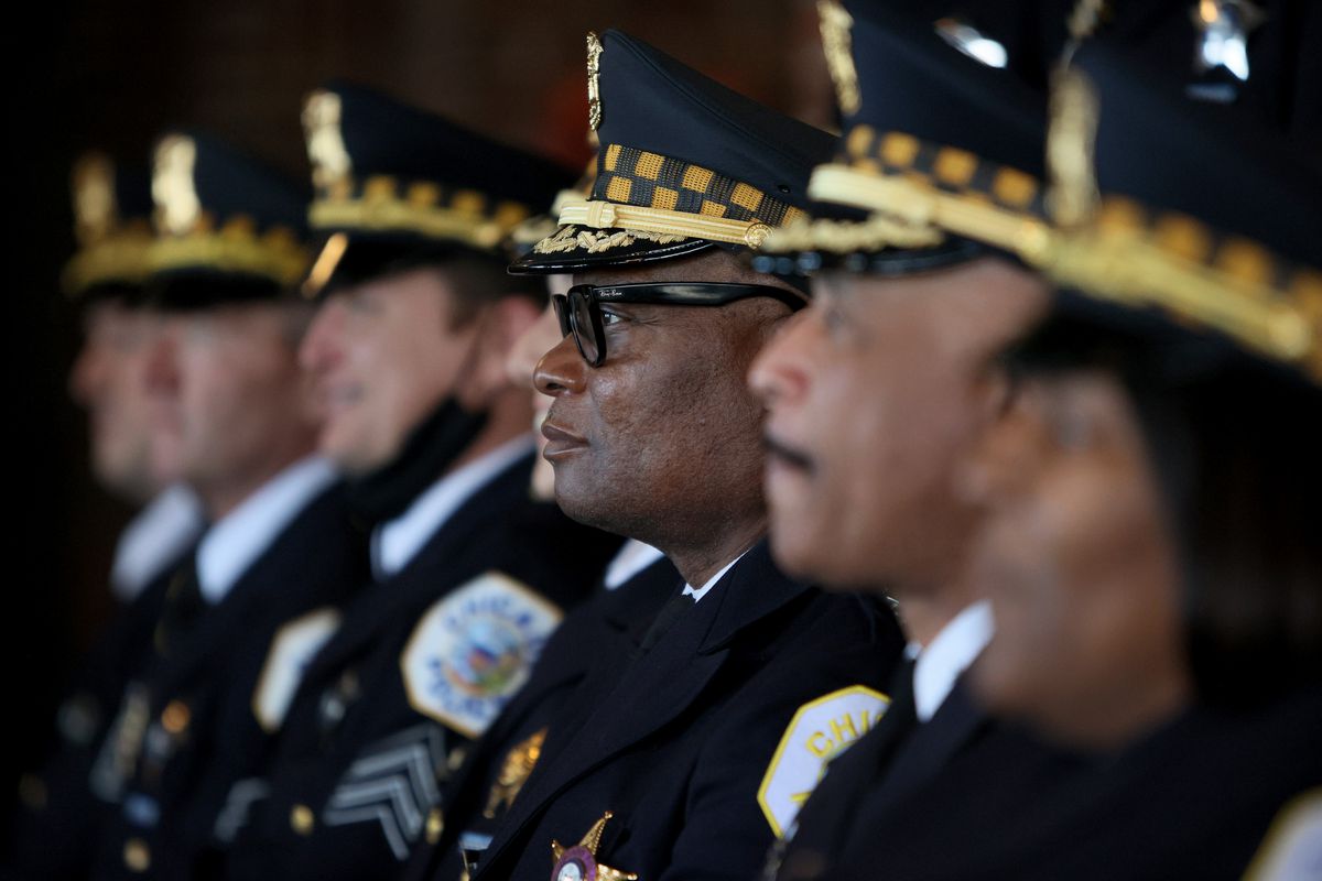 CHICAGO, ILLINOIS - OCTOBER 20: Chicago police Superintendent David Brown (C) poses for pictures with other officers at a Chicago Police Department promotion and graduation ceremony on October 20, 2021 in Chicago, Illinois. The city of Chicago has started to place police officers on unpaid leave for refusing to comply with the city’s requirements that they report their COVID-19 vaccination status. Only about 65 percent of the city’s police have complied with the order. (Photo by Scott Olson/Getty Images) ORG XMIT: 775726853