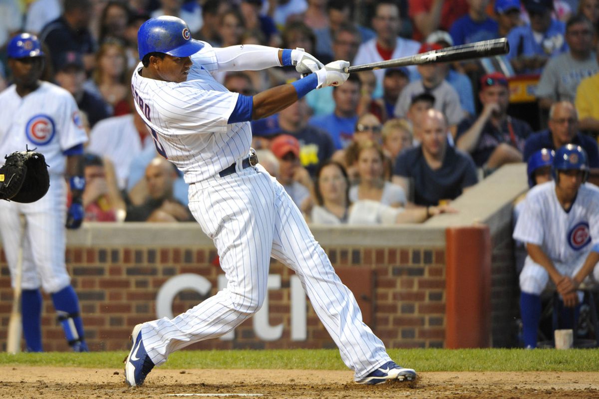 Chicago, IL, USA; Chicago Cubs shortstop Starlin Castro hits an RBI double against the Boston Red Sox at Wrigley Field.  Credit: Rob Grabowski-US PRESSWIRE