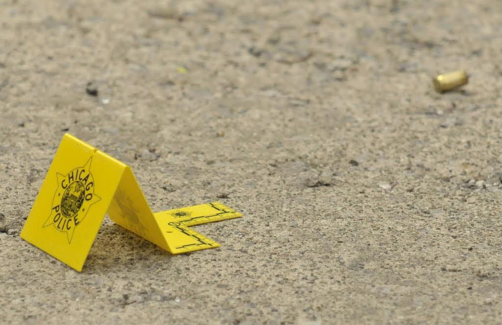 Police investigate after a fatal shooting Wednesday night near Ohio and Mayfield. / photo from Network Video Productions