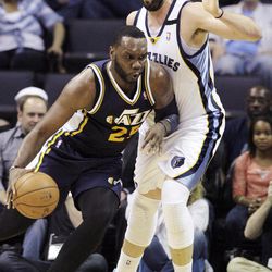 Utah Jazz's Al Jefferson (25) drives against Memphis Grizzlies' Marc Gasol, of Spain, during the first half of an NBA basketball game in Memphis, Tenn., Wednesday, April 17, 2013. 