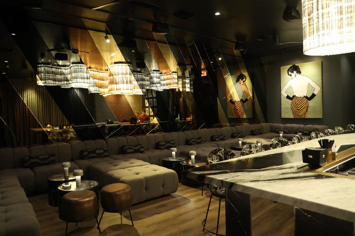 Or Bar interior with lounges, chairs and a large mirror in West Hollywood, California.