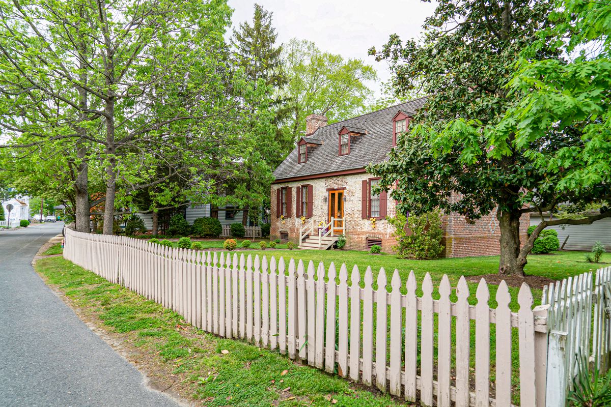 Historic home in Maryland with a surrounding fence