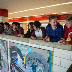 East High School students listen to remarks from Principal Greg Maughan during the opening of the school's expanded Leopard Stash food pantry in Salt Lake City on Tuesday, Nov. 20, 2018.