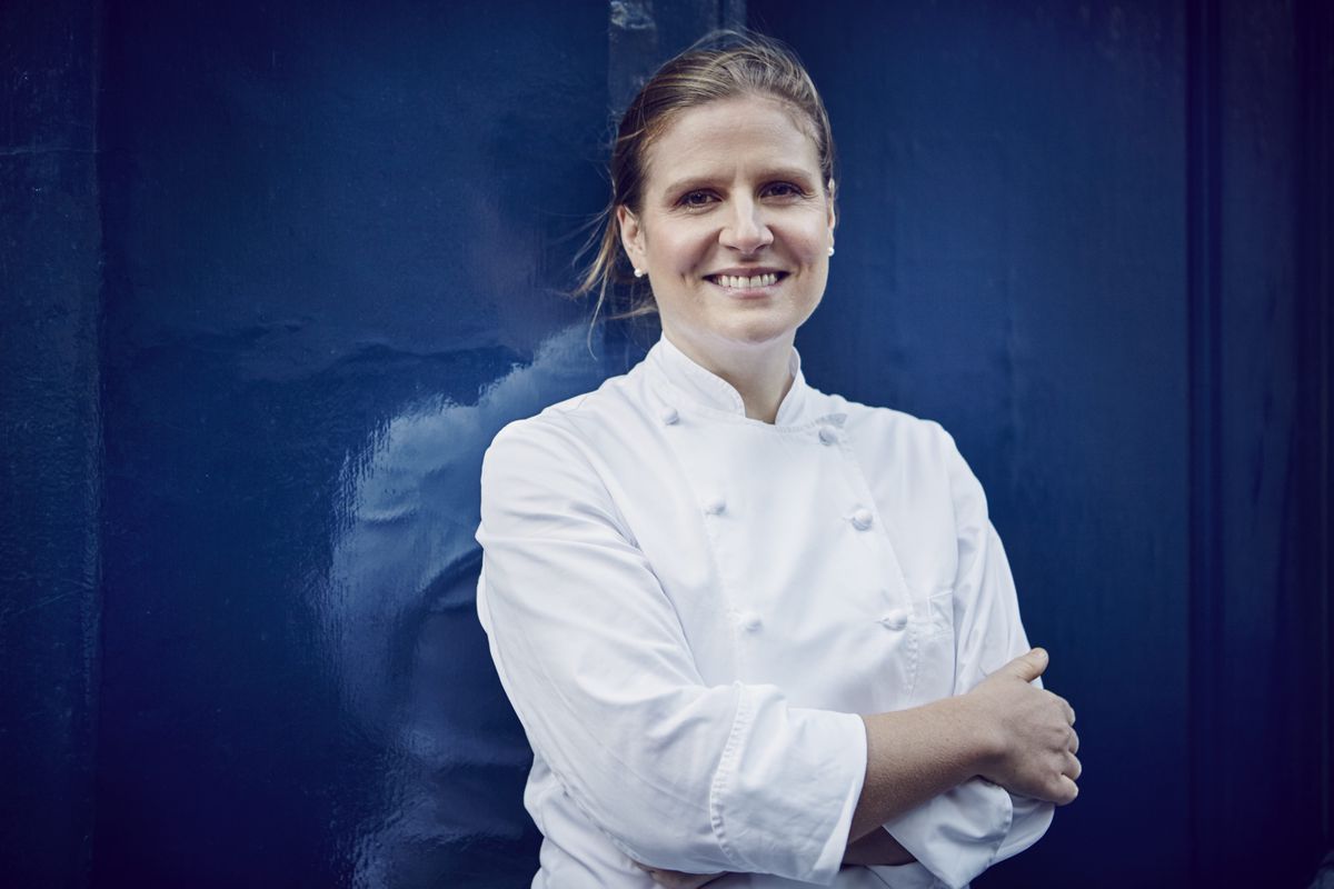Chef Chantelle Nicholson in portrait, against a blue background