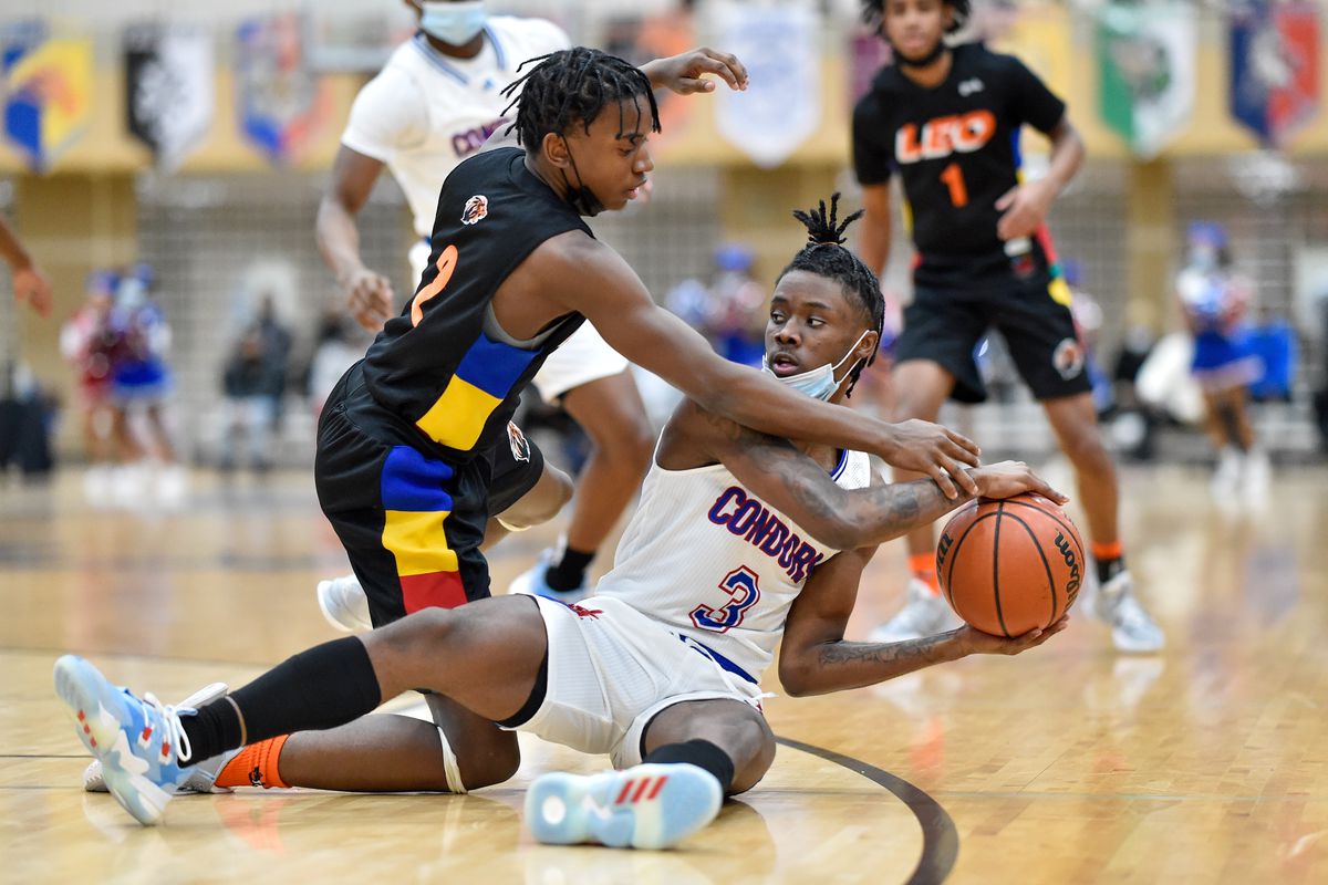 Curie’s Shawn Brown (3) keeps the ball from Leo’s Christian Brockett (2).