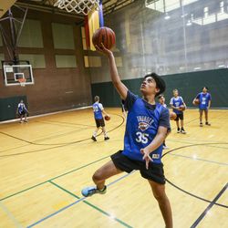 Diego Blackard performs a layup while he warms up during practice with the Utah Thunder youth basketball team at the Kearns Oquirrh Park Fitness Center in Kearns on Thursday, Sept. 12, 2019. Utah’s teen obesity rates are low compared to the rest of the nation, but they are slowly on the rise.