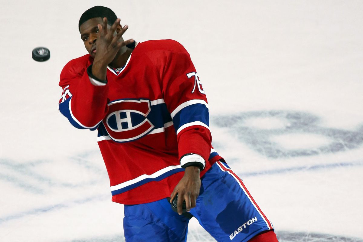 Montreal Canadiens defenseman P.K. Subban (76) gives away a puck as he is named first star of the game against New Jersey Devils at Bell Centre.