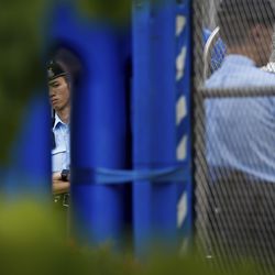 Policemen stand guard behind the barriers outside the Central Government Office building in Hong Kong, Friday, July 5, 2019. Student unions from two Hong Kong universities said Friday that they have turned down invitations from city leader Carrie Lam for talks about the recent unrest over her proposal to allow the extradition of suspects to mainland China. (AP Photo/Andy Wong)