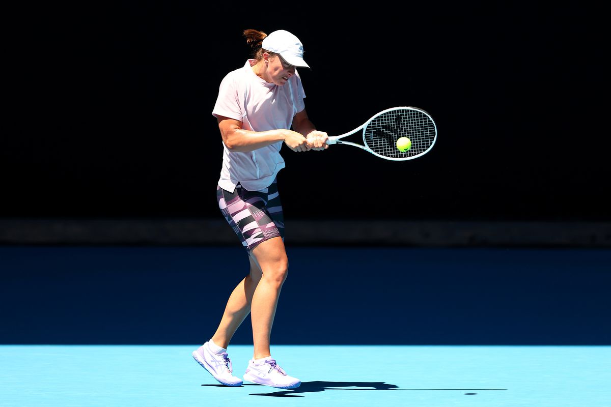 Iga Swiatek of Poland plays a backhand during a practice session ahead of the 2023 Australian Open at Melbourne Park on January 11, 2023 in Melbourne, Australia.