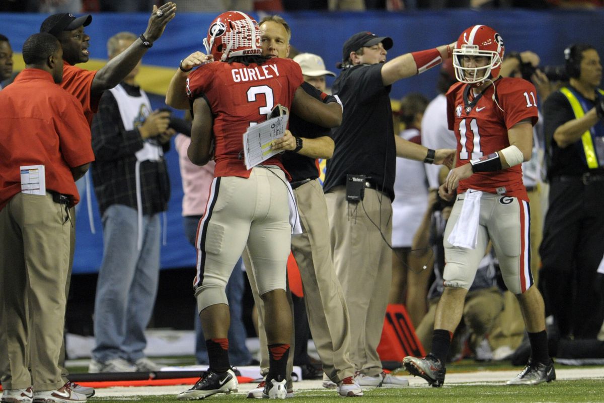 Mark Richt is seen here reassuring Todd Gurley that the sun will in fact come up tomorrow. 