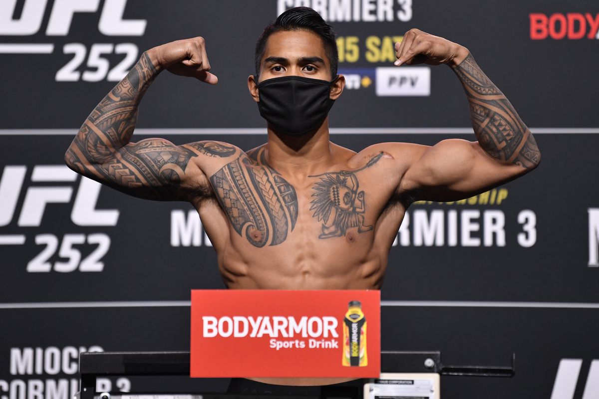 Kai Kamaka poses on the scale during the UFC 252 weigh-in at UFC APEX on August 14, 2020 in Las Vegas, Nevada.