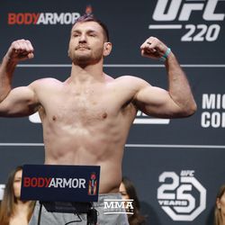 Stipe Miocic poses at UFC 220 weigh-ins.