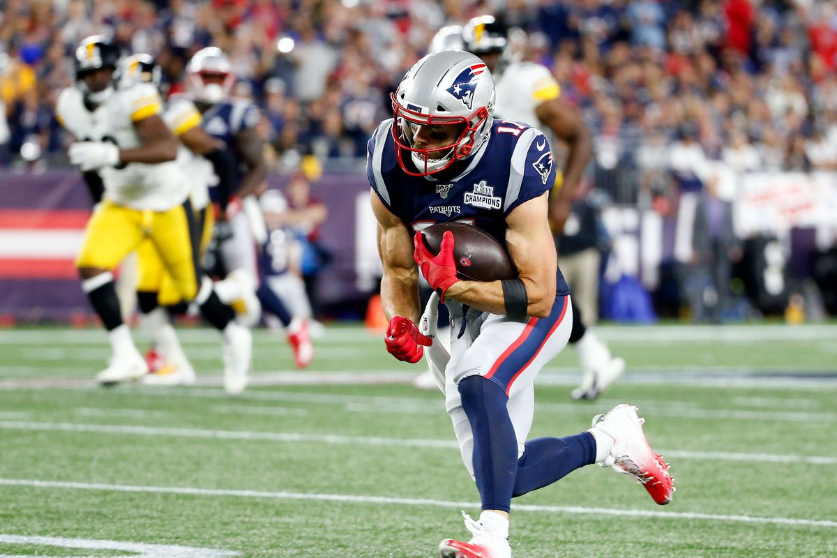 New England Patriots wide receiver Julian Edelman runs with the ball against the Pittsburgh Steelers during the first half at Gillette Stadium.