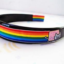 <a href="http://www.etsy.com/listing/81856760/pop-tart-nyan-cat-headband" rel="nofollow">Nyan Cat</a>: this time with 50 percent more rainbow.