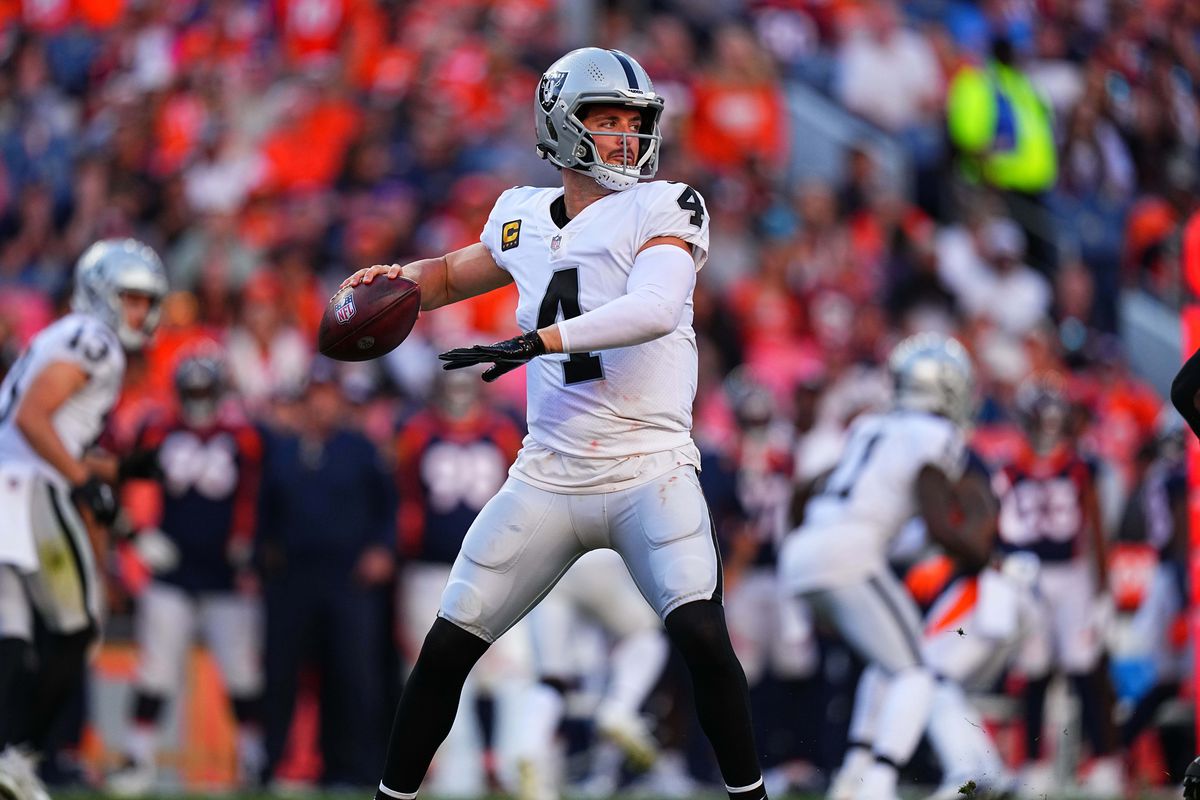 Las Vegas Raiders quarterback Derek Carr (4) looks to pass the ball in the fourth quarter against the Denver Broncos at Empower Field at Mile High.&nbsp;
