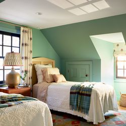 A guest bedroom on the second floor of the  original portion of the Cape is the most  unchanged room in the house.