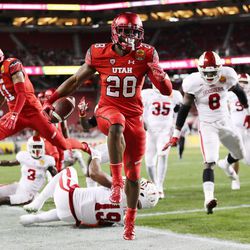 Utah Utes running back Joe Williams (28) scores a touchdown as the Utes and the Hoosiers play in the Foster Farms Bowl in Santa Clara, California, on Wednesday, Dec. 28, 2016.