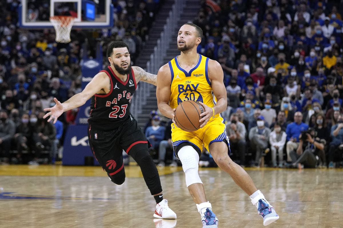 Stephen Curry #30 of the Golden State Warriors goes up to shoot a three-point shot over Fred VanVleet #23 of the Toronto Raptors during the second half of an NBA basketball game at Chase Center on November 21, 2021 in San Francisco, California.