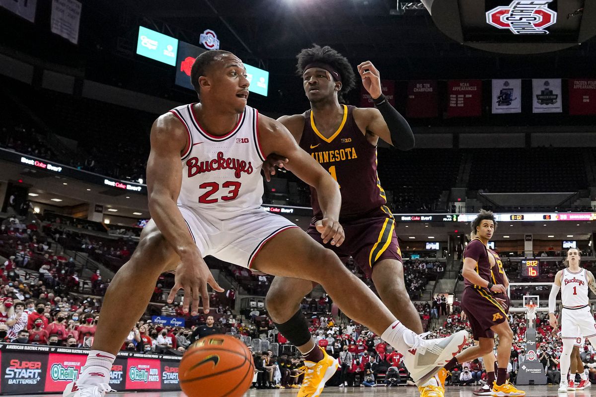 Ohio State Buckeyes forward Zed Key dribbles around Minnesota Golden Gophers forward Eric Curry during the second half of the NCAA men’s basketball game at Value City Arena in Columbus on Tuesday, Feb. 15, 2022.