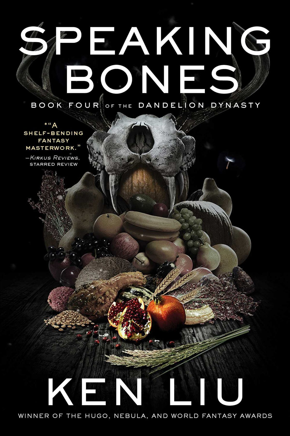 The cover image for Ken Liu’s Speaking Bones, which depicts a cornucopia of fruits and vegetables inside an antlered skull.