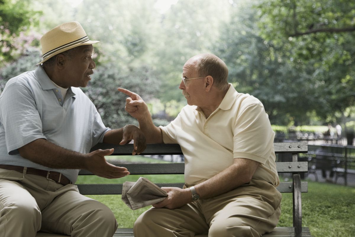 Two men arguing on a bench