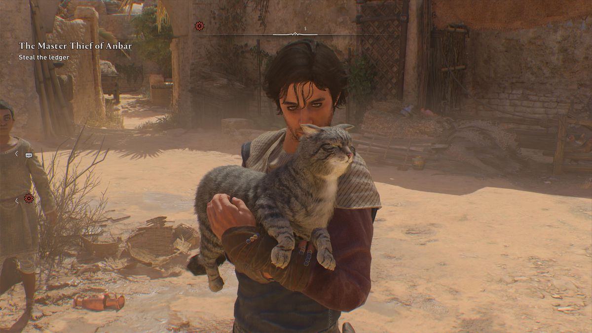 Basim holds a tabby cat on the streets of Baghdad in Assassin’s Creed Mirage. It’s a real cut cat.