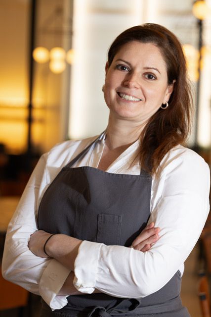 A pastry chef in her apron. 