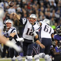 New England Patriots quarterback Tom Brady (12) throws to a receiver in the first half of an NFL football game against the Baltimore Ravens, Sunday, Dec. 22, 2013, in Baltimore. 