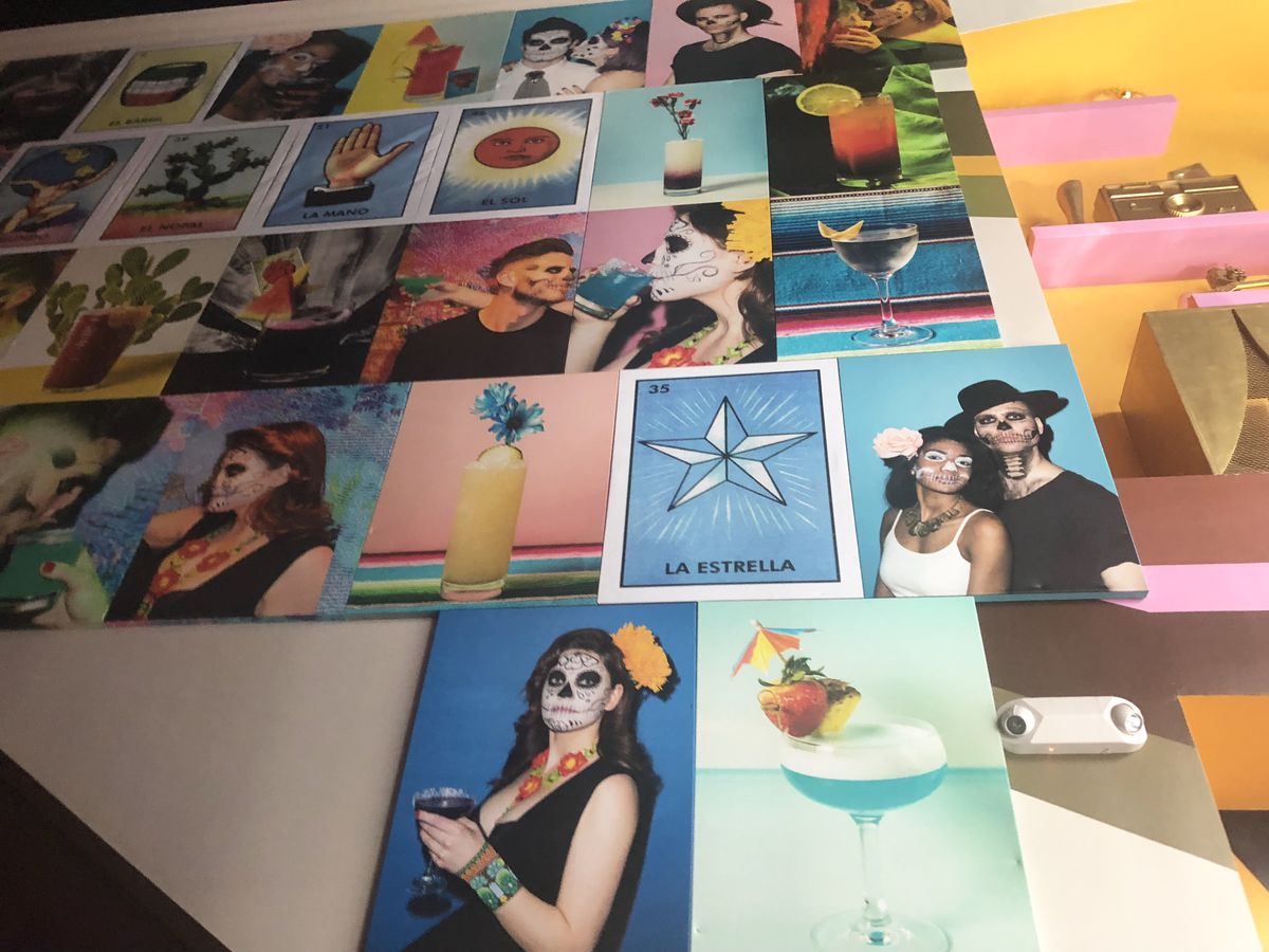 A colorful wall of photographs at Vida Verde
