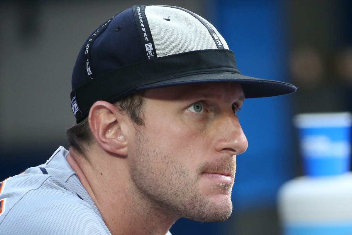 Max Scherzer wears a rally cap during the 19 inning game on August 10, 2014