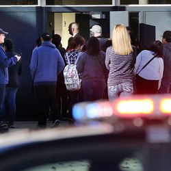Parents enter Mountain View High School in Orem on Tuesday, Nov. 15, 2016, to pick up students after five students were stabbed in an apparent attack by a 16-year-old boy.