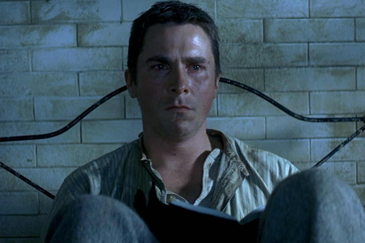 The Prestige: Christian Bale sits in bed feeling weepy
