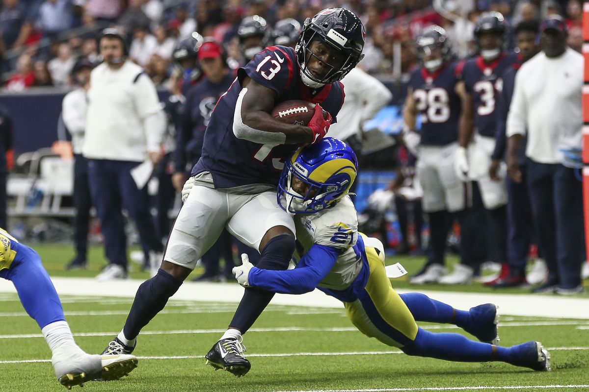 Houston Texans wide receiver Brandin Cooks (13) runs with the ball as Los Angeles Rams cornerback Donte’ Deayon (21) attempts to make a tackle during the fourth quarter at NRG Stadium.&nbsp;
