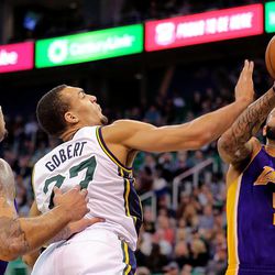 Utah Jazz center Rudy Gobert (27) battles Los Angeles Lakers forward Carlos Boozer (5) for the ball as the Jazz and the Lakers play Wednesday, Feb. 25, 2015, at EnergySolutions Arena in Salt Lake City.