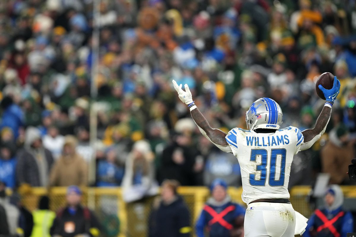 Jamaal Williams of the Detroit Lions celebrates after scoring a touchdown in the fourth quarter of the Lions’ 20-16 win against Green Bay on Jan. 8, 2023.