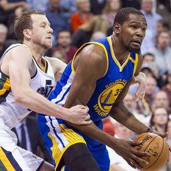 Utah forward Joe Ingles (2) commits a foul against Golden State forward Kevin Durant (35) during the second half of an NBA basketball game in Salt Lake City on Thursday, Dec. 8, 2016. Golden State defeated Utah with a final score of 106-99.