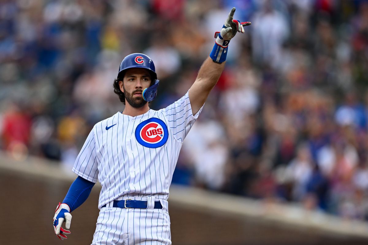 Dansby Swanson of the Chicago Cubs reacts after his RBI double in the seventh inning against the Atlanta Braves at Wrigley Field on August 06, 2023 in Chicago, Illinois.