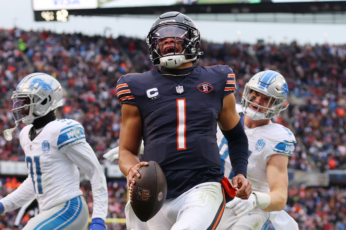 Justin Fields of the Chicago Bears celebrates a rushing touchdown against the Detroit Lions at Soldier Field on December 10, 2023 in Chicago, Illinois.