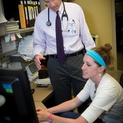 Dr. Nathan Wanner addresses Melissa Gurr, RN, at University of Utah Hospital. 