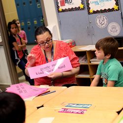 Second-grade teacher Marcia Hank works with her students at Woodrow Wilson Elementary School in Salt Lake City on Friday, March 4, 2016.  