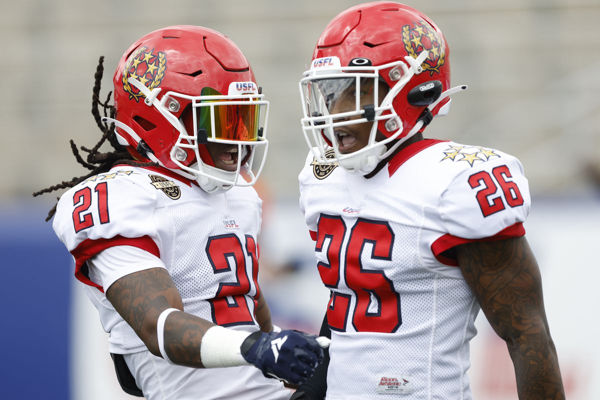 DeJuan Neal #26 of New Jersey Generals celebrates with Trae Elston #21 after breaking up a pass intended for Tre Walker #89 of Pittsburgh Maulers during the first quarter at Protective Stadium on May 07, 2022 in Birmingham, Alabama.