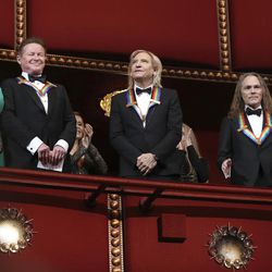 Recipients of the 2016 Kennedy Center Honor award, the members of the Eagles band, from left, Don Henley, Joe Walsh, and Timothy Schmit, applaud during the Kennedy Center Honors Gala at the Kennedy Center in Washington, Sunday, Dec. 4, 2016. 