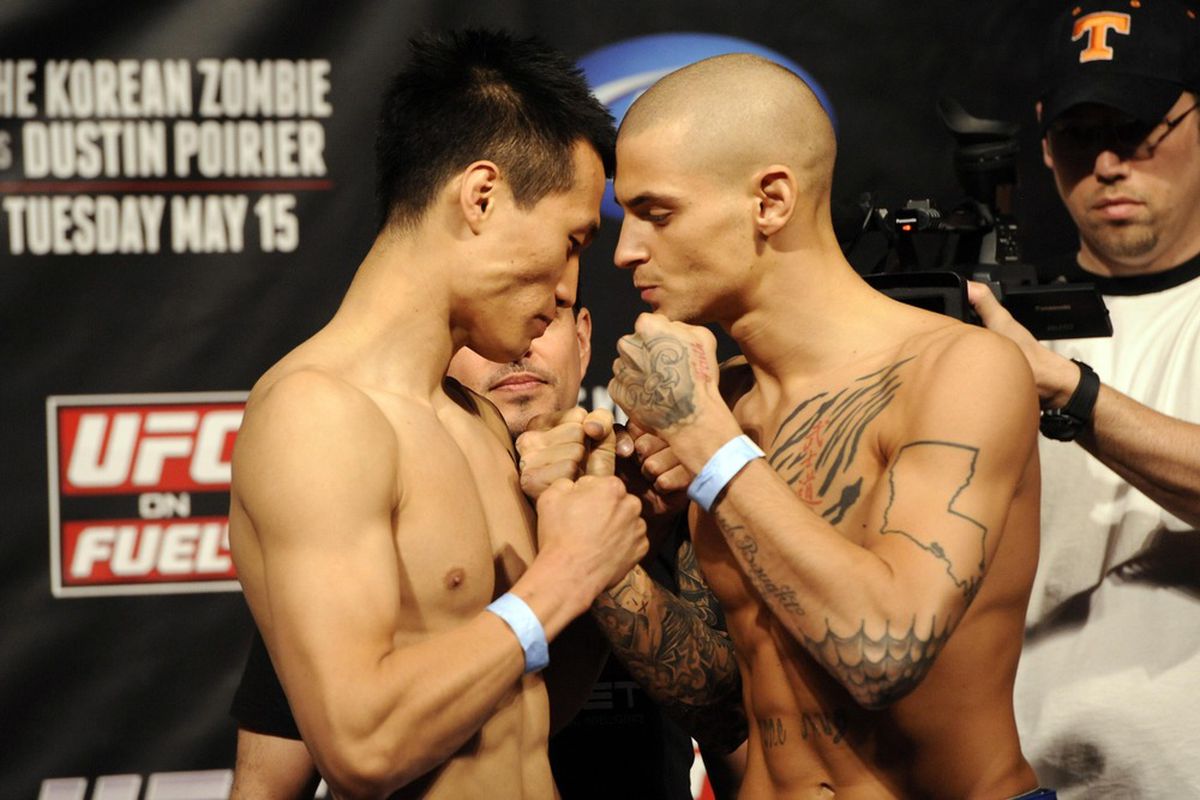 May 14, 2012; Fairfax, VA, USA; Korean Zombie (left) and Dustin Poirier (right) pose during the Korean Zombie vs Poirier weigh-in at Patriot Center. (Photo: Rafael Suanes-US PRESSWIRE)