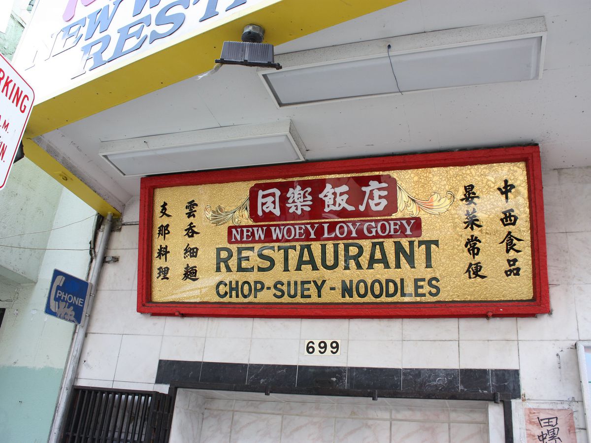 Sign for “New Woey Loy Goey Restaurant, Chop-Suey - Noodles”