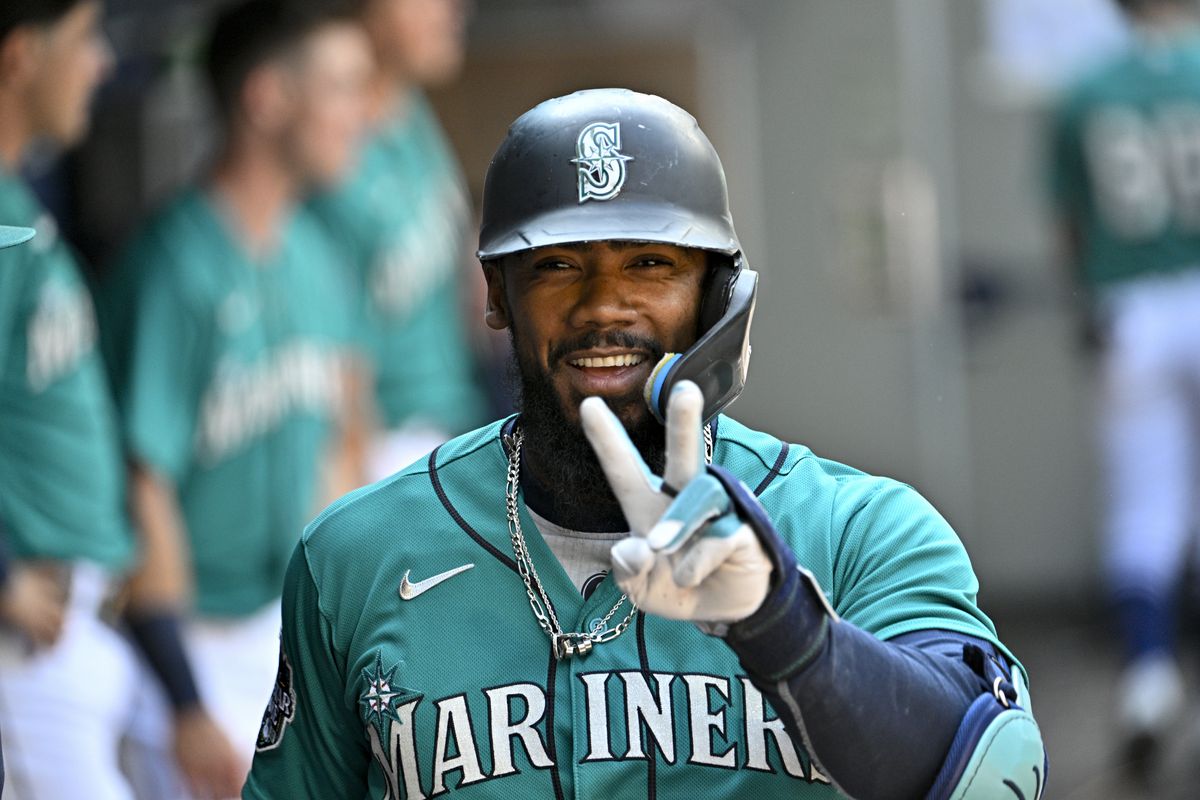 Teoscar Hernandez of the Seattle Mariners celebrates with teammates after hitting a solo home run during the eighth inning against the Kansas City Royals at T-Mobile Park on August 26, 2023 in Seattle, Washington.