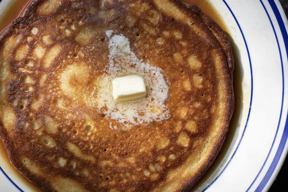 up close photo of a pancake with butter on top